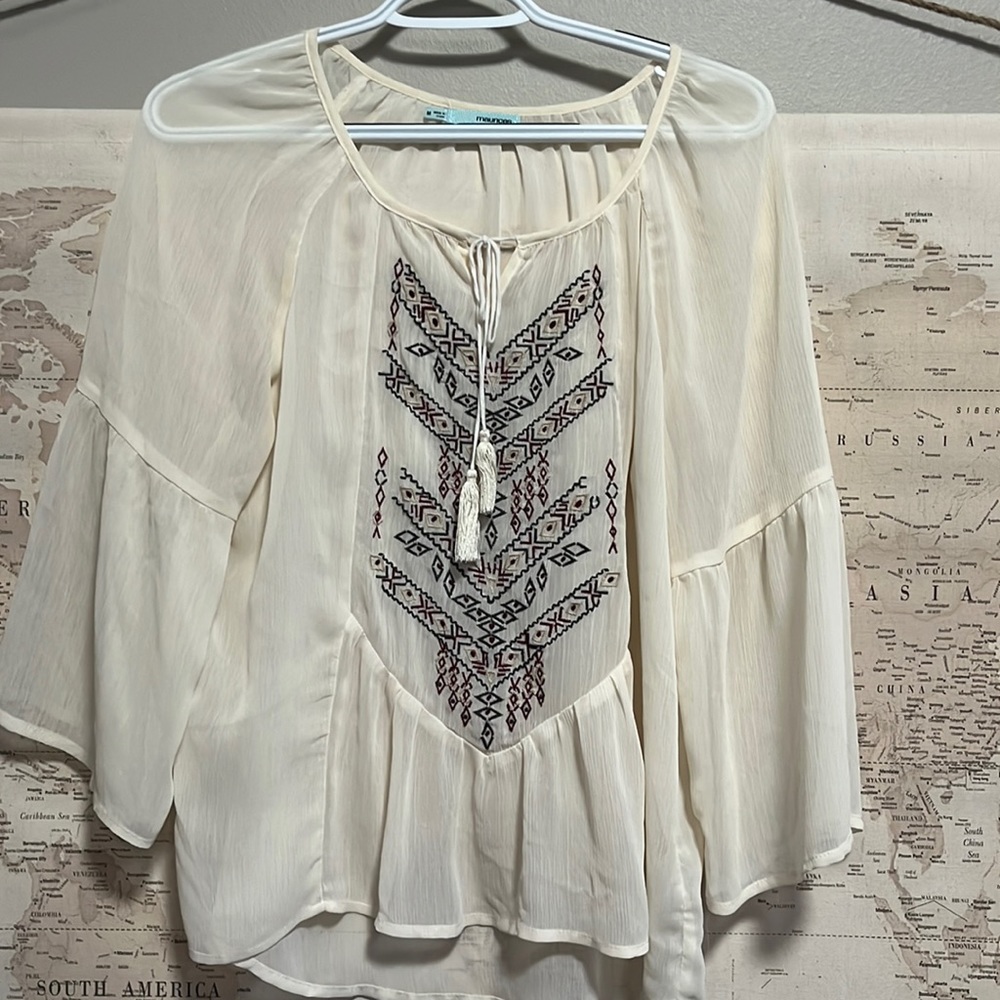 Cute sheer light fabric shirt. Easy to dress up or dress down. Hardly worn.